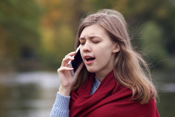 Nervous frustrated angry young woman, irritated girl talking on cell mobile phone, having negative conversation on smartphone, screaming - Фото, зображення
