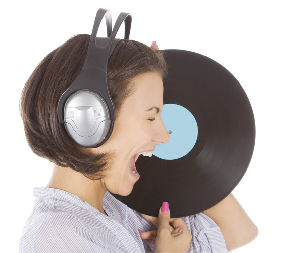 Profile of emotional brunette in headphones with vinyl record ov - Fotoğraf, Görsel