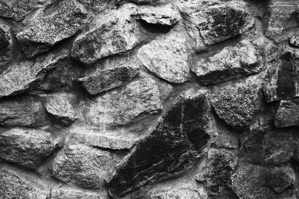 velké kameny, kamenná zeď, starobylá hradní zeď, tmavé texturované stěny - Fotografie, Obrázek
