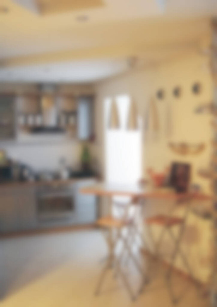 Blurred background of home kitchen interior. Defocused image to place your design. Modern stylish apartment interior themed abstract blur background with bokeh - Photo, Image