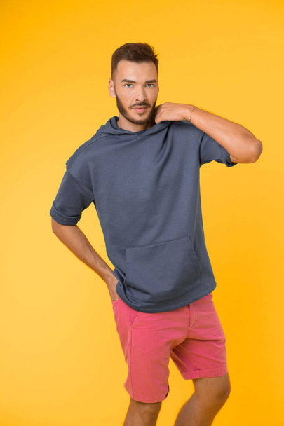 Active concept. Active lifestyle. Man in active wear on yellow background. Be active in style - Foto, Imagen