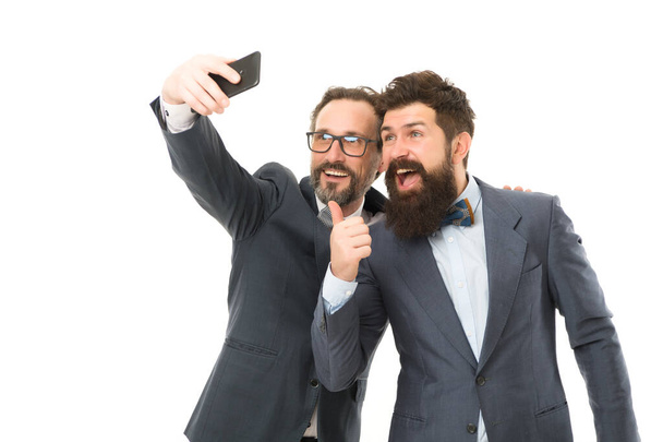 mature men making selfie. Agile business. collaboration and teamwork. partnership of men speaking on phone. bearded businessmen in formal suit. business communication on meeting. team success - Fotoğraf, Görsel