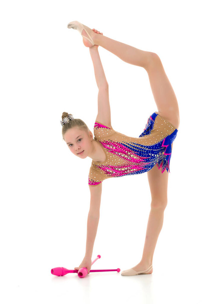 A girl gymnast performs exercises with a mace. - Fotó, kép