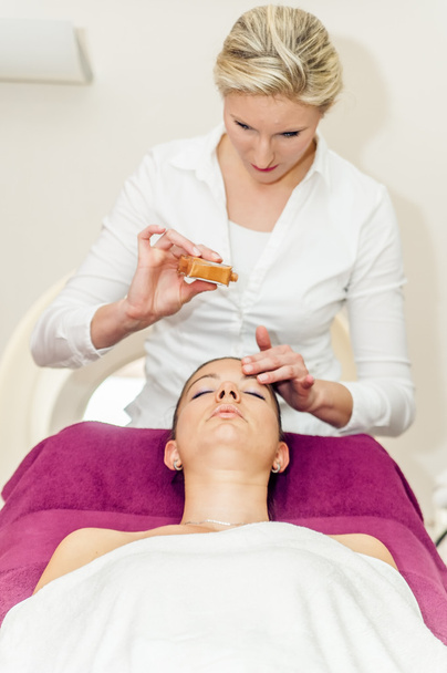 Massage oil on the forehead - Fotoğraf, Görsel