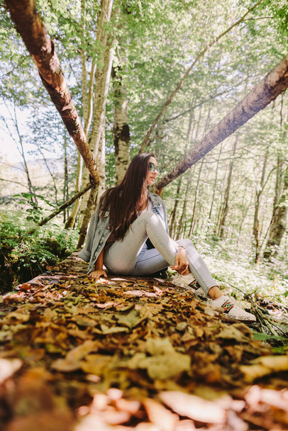 woman relax in autumn forest - 写真・画像
