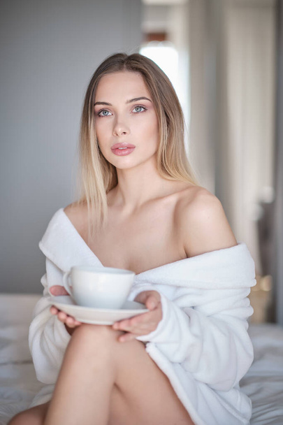 woman drinking morning coffee in her apartment - Photo, Image