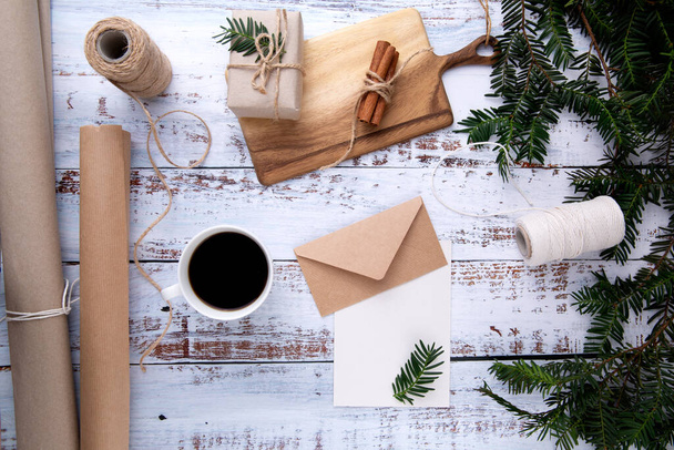 handmade gifts ,cup of coffee and card with pen on an old wooden table  - 写真・画像