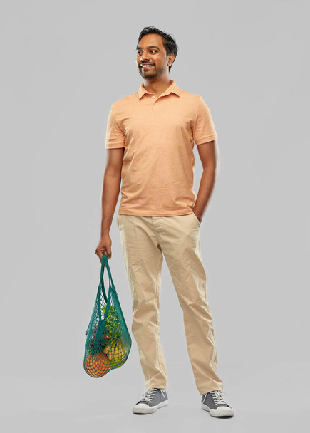 happy indian man with food in reusable net tote - Foto, Imagem