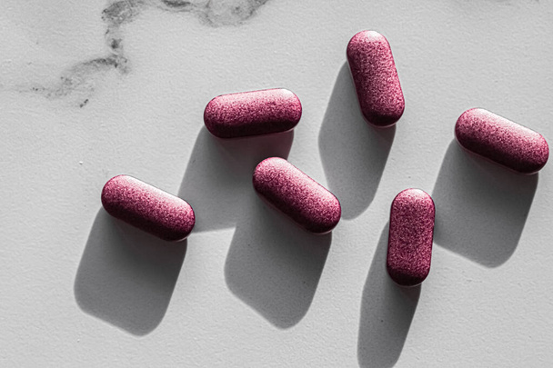 Pink pills as herbal medication, pharma brand store, probiotic drugs as nutrition healthcare or diet supplement products for pharmaceutical industry ad - 写真・画像