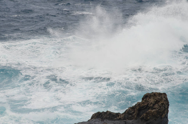 Wave breaking on the coast of Arucas. - Photo, Image