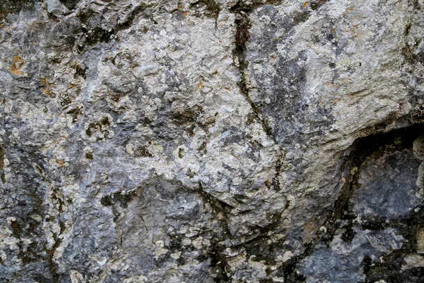 The texture of the rock. Mountain cliff of rock surface.  Natural cave wall. - Photo, Image