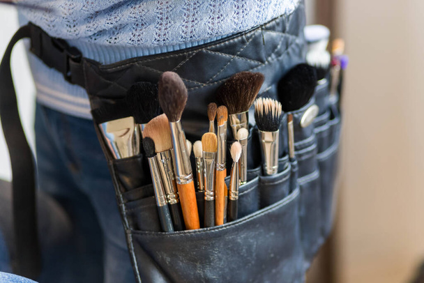 Professional make-up artist belt bag with tassels. makeup brushes - Foto, Imagem