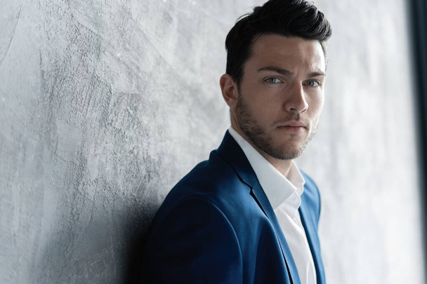 Handsome man wear blue suit isolated on grey background. - Φωτογραφία, εικόνα