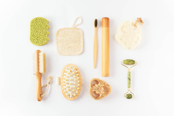 Ecology, zero waste concept. Reusable items for beauty treatment from organic biodegradable material, quartz face roller, anti cellulite massager, bamboo toothbrush - Foto, Bild