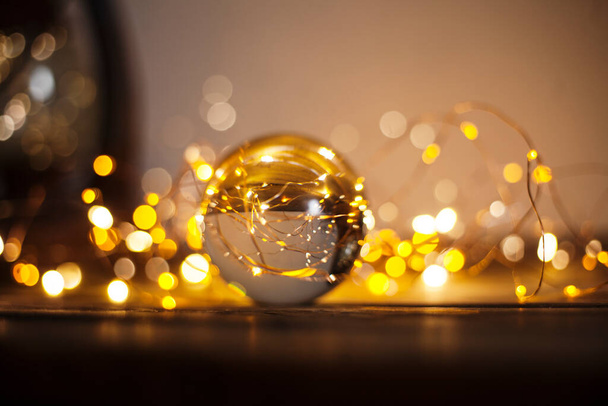 new year and christmas background with lights and lens ball/abstract winter holidays background - Photo, image