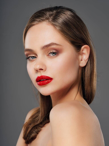 Sexy lady with red lips and naked shoulders close-up - Zdjęcie, obraz