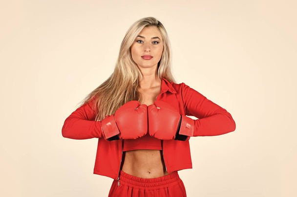 Self improvement. Sporty girl red clothes boxing gloves. Gym and workout. Fitness model. Sporty lifestyle. Sporty woman fitness trainer. Overcome problems. Personal training. Fight with own complex - Photo, image
