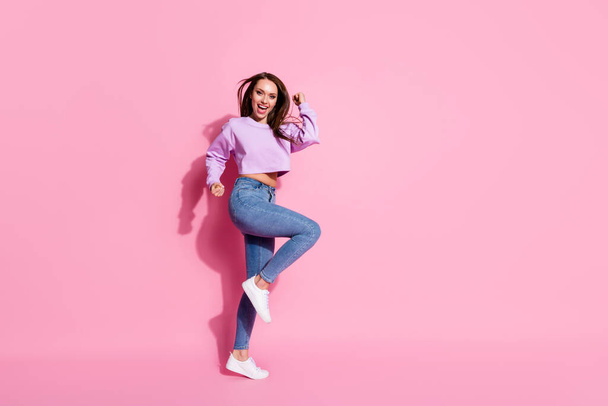 Full length photo of delighted girl celebrate lottery win raise fists scream yes wear lilac pullover sneakers isolated over pastel color background - Foto, afbeelding