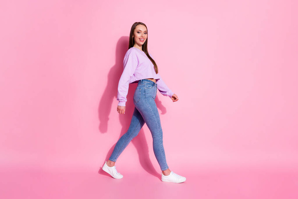 Full length profile side photo of attractive cute nice girl go walk copyspace enjoy free time holiday weekend isolated over pink color background - Fotografie, Obrázek