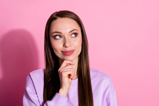 Closeup photo of attractive beautiful lady arms on chin interested wondered look up side empty space thinking clever person wear casual purple sweater isolated pink pastel color background - Foto, Bild