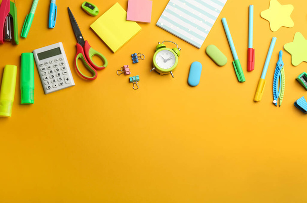 School stationery on yellow background, flat lay with space for text. Back to school - 写真・画像