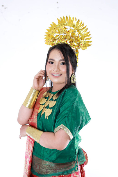 Beautiful smiling Asian girl wearing a set of modern traditional clothes, the traditional female outfits originated from Indonesia. Indonesian Women - Photo, Image