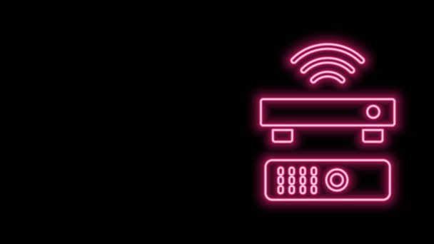 Gloeiende neon lijn Draadloze multimedia en TV box ontvanger en speler met afstandsbediening pictogram geïsoleerd op zwarte achtergrond. 4K Video motion grafische animatie - Video