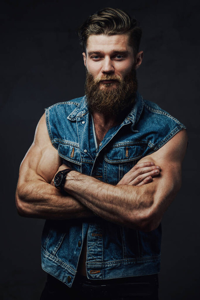 Fashionable guy with muscular hands posing in studio - Photo, image
