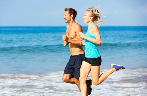 Sporty couple jogging together - Фото, изображение