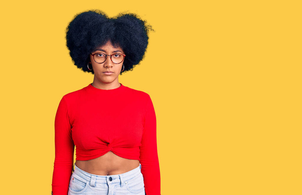 Young african american girl wearing casual clothes and glasses depressed and worry for distress, crying angry and afraid. sad expression.  - Photo, Image