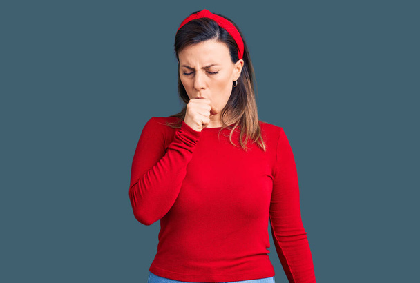 Young beautiful woman wearing casual clothes feeling unwell and coughing as symptom for cold or bronchitis. health care concept.  - Photo, Image