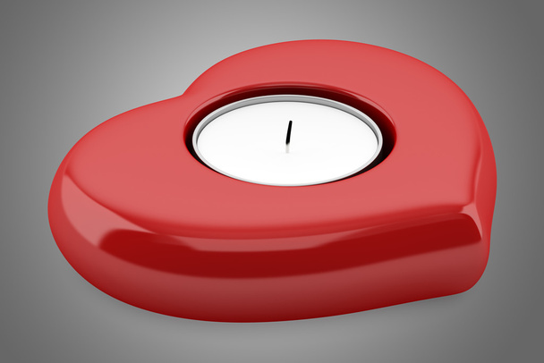red heart-shaped candlestick with candle isolated on gray backgr - Photo, Image