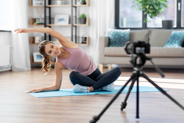 woman or sports blogger streaming online yoga - Foto, afbeelding