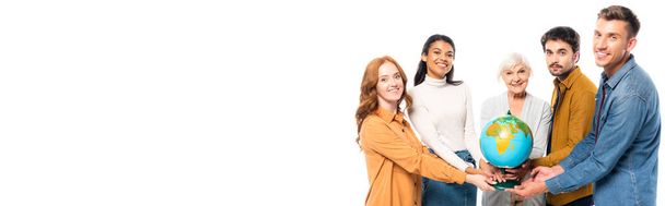 Multicultural people smiling at camera while holding globe together isolated on white, banner  - Foto, afbeelding