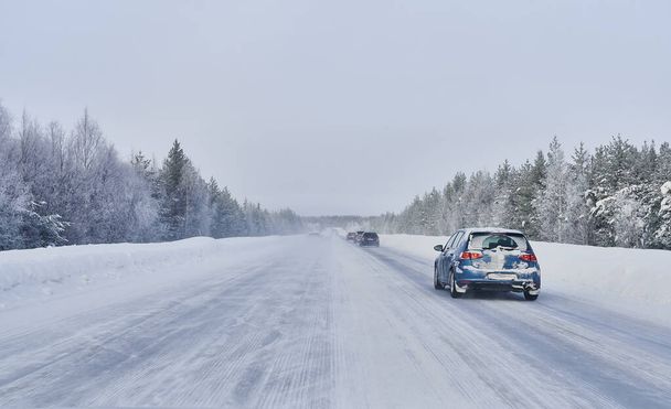We drive in a magnificent winter landscape with icy roads and beautiful views, The road goes from Lule on the coast of Norrbotten to Jokkmokk in Swedish Lapland and on to a small lake far out in the wilderness - Photo, Image