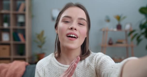 Close up view of millennial woman having video conversation and using phone frontal camera. Happy female person saying with sign language Fine news. Concept of deaf disability. - Video