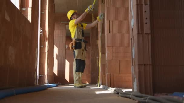 Caucasian Construction Site General Manager Measuring Building Interior Elements To Make Sure Everything Has Been Done Correctly. - Footage, Video
