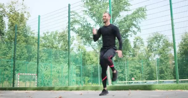 Deportista corriendo en el acto  - Imágenes, Vídeo