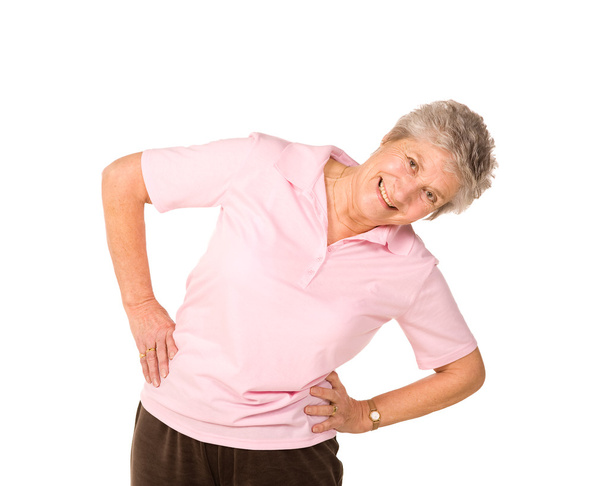 Senior lady stretching before exercise - Photo, image