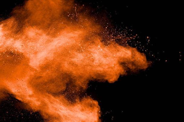 oranžový prášek exploze na černém pozadí. - Fotografie, Obrázek