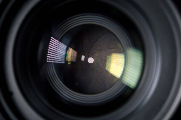 Fényképezés Camera or Video lens close-up on black background, objektív, koncepció fotós kamera ember munka, keres egy fotós, újságíró, egy videós dolgozni - Fotó, kép
