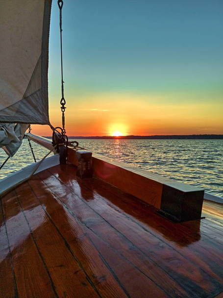 Yacht sailing at beautiful sunset in summer. - Photo, Image