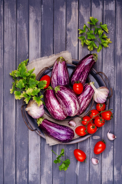 Raw vegetables with a metal dish on a gray wooden background. Selective focus. - Photo, Image