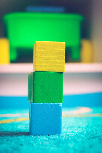 A vertical shot of wooden toy blocks - Fotoğraf, Görsel