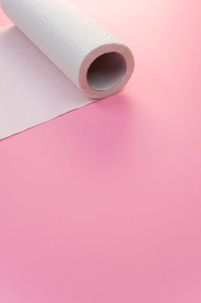 A closeup shot of a paper towel on a pink background with a copy space - Photo, image