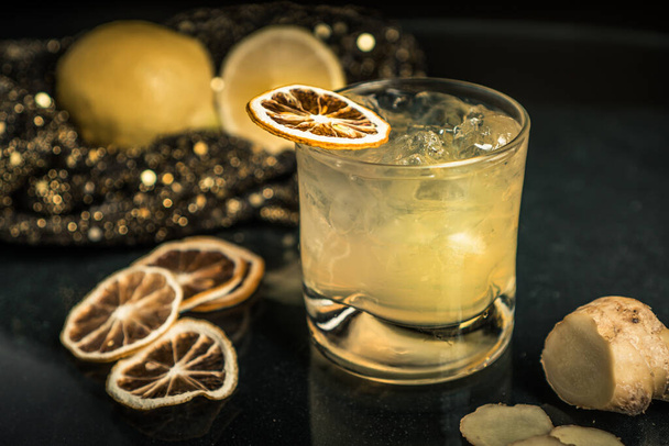 A closeup shot of an alcoholic cocktail with dried lemon - Photo, Image
