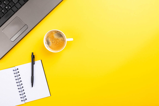 The flat lay of the office working tools on the yellow surface - space for text - Foto, Bild