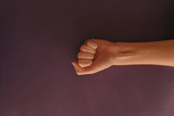 A closeup shot of clenched fist - concept of solidarity and support - Photo, Image