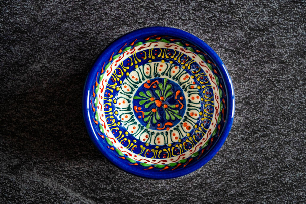 Handmade Ceramic Bowls and Cups Handcrafted with Traditional Ottoman Pattern on Dark Surface and Backround / Handicraft. Ready to Use. - Foto, immagini