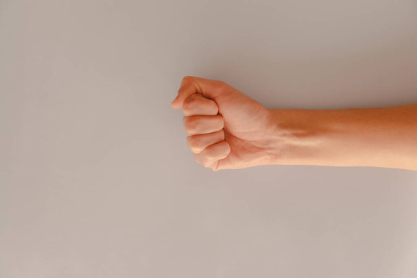A closeup shot of clenched fist - concept of solidarity and support - Foto, Bild